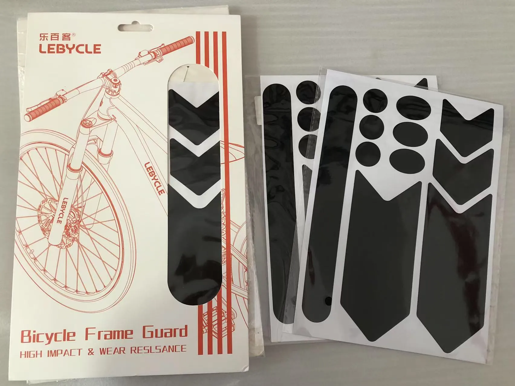 Het fietsframe van JOJO Pack beschermt de bestelling van monsterstickers